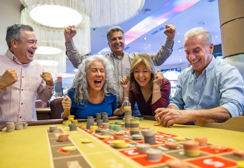 A happy family is enjoying a casino game night in Black Hawk, CO, & the Denver metro