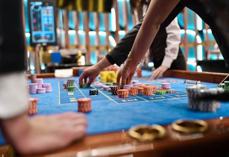 Pai Gow Poker game in progress with stacked chips in Black Hawk, CO, & the Denver metro